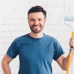 happy-man-preparing-for-paint-new-apartment-walls-2021-08-30-02-11-38-utc.jpg